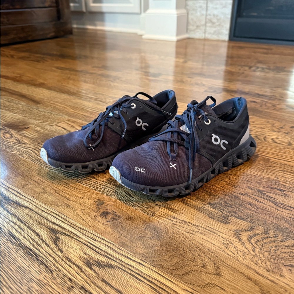On Running Black Athletic Shoes with CloudTec Technology